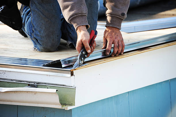 Professional contractor installing a new seamless gutter system for a home in Cincinnati Ohio